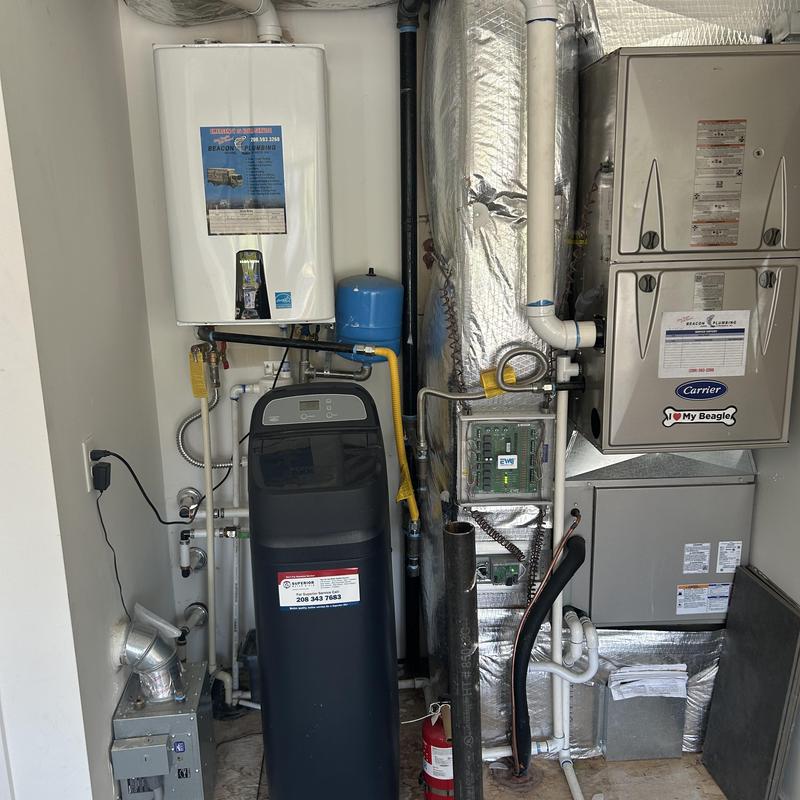Water softener system with tankless water heater and furnace