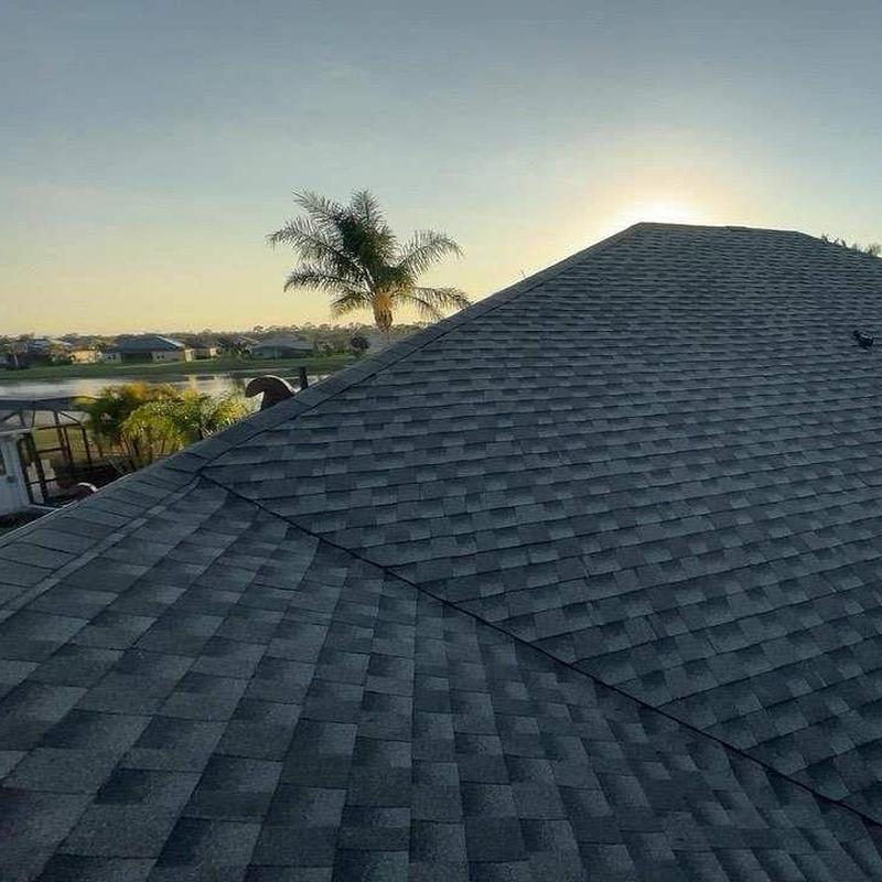 Architectural shingle roof with sunset in Oviedo, FL Architectural shingle roof with sunset in Oviedo, FL