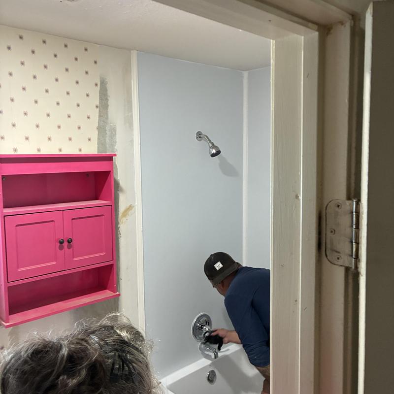 Shower walls installation and valve cap removal Shower walls installation and valve cap removal