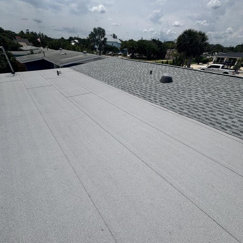Modified bitumen flat porch roof with tapered drain system Modified bitumen flat porch roof with tapered drain system