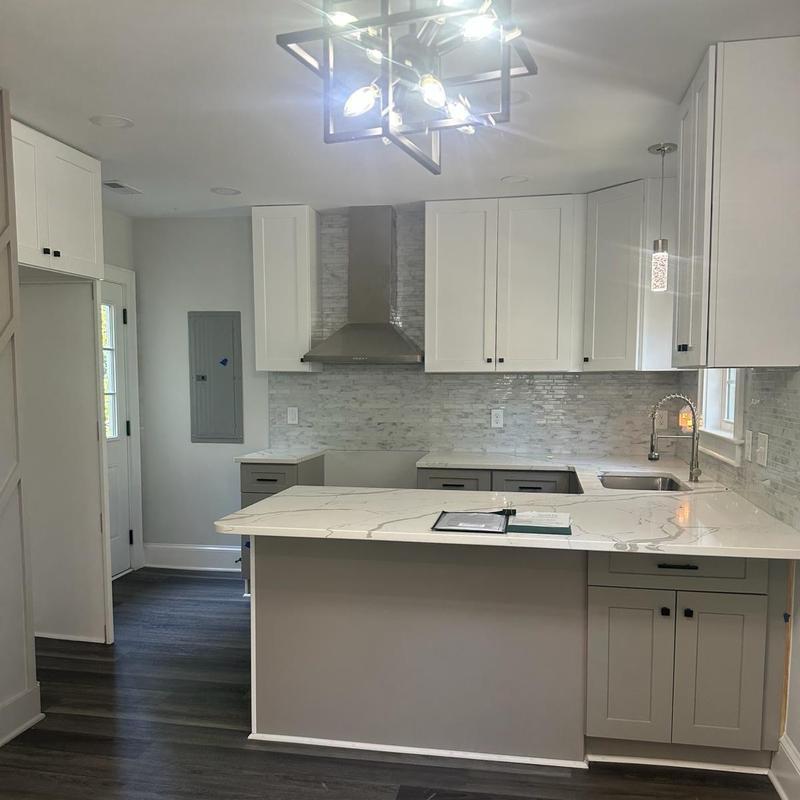 Quartz kitchen countertops and white cabinetry installation Quartz kitchen countertops and white cabinetry installation