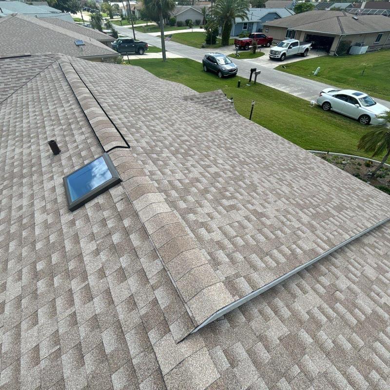 Architectural shingle roof with new skylight installation Architectural shingle roof with new skylight installation