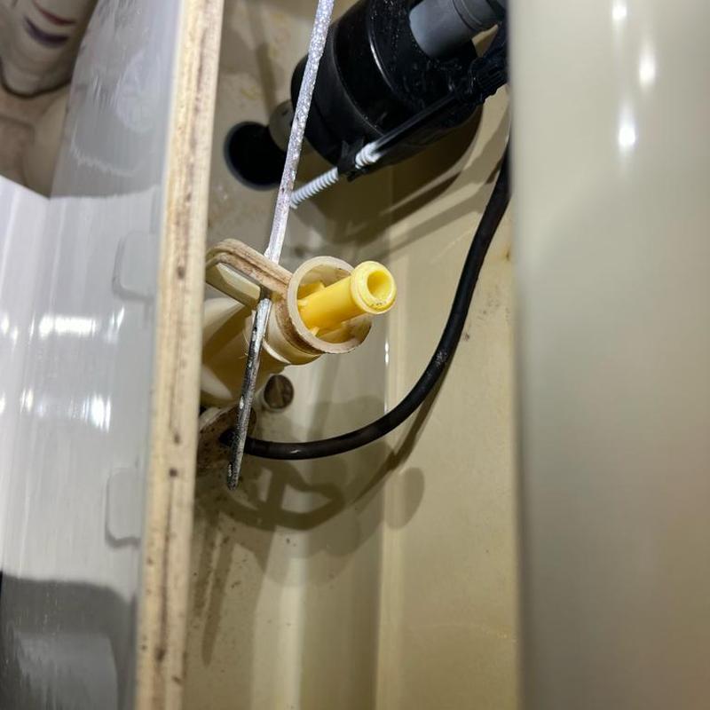 Flush valve housing inside toilet tank close-up Flush valve housing inside toilet tank close-up