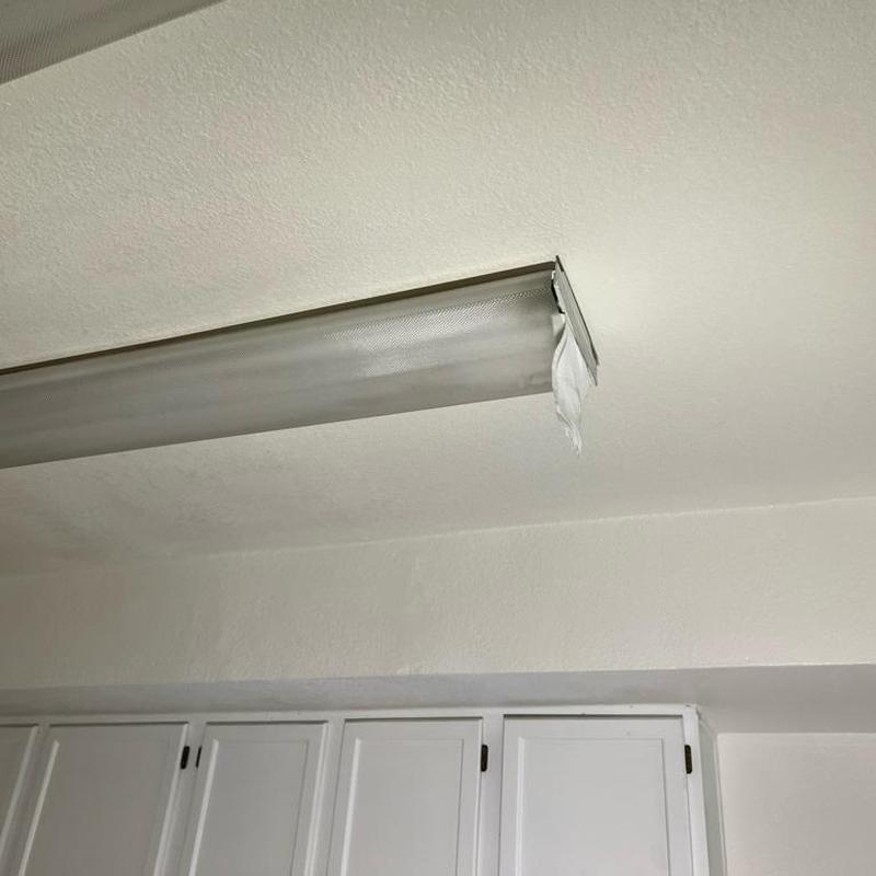 Ceiling light fixture with water damage and missing cover Ceiling light fixture with water damage and missing cover