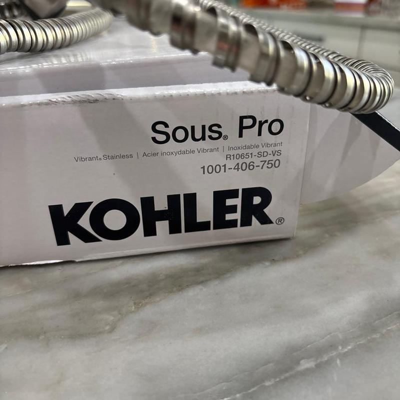 Kohler Sous Pro faucet box and flexible hose close-up Kohler Sous Pro faucet box and flexible hose close-up