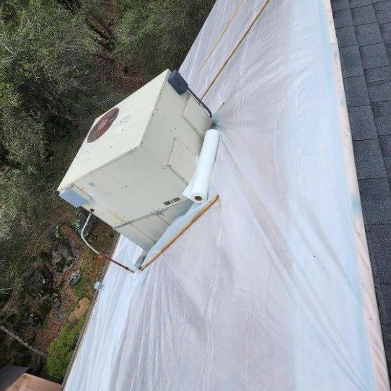 Asphalt roof underlay with HVAC unit on roof