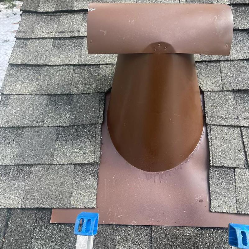 Roof vent with new flashing on shingle roof