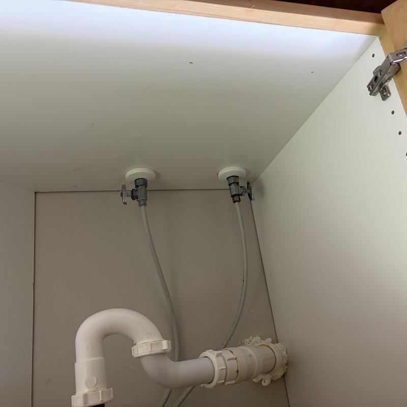 Sink drain and water supply lines under cabinet Sink drain and water supply lines under cabinet