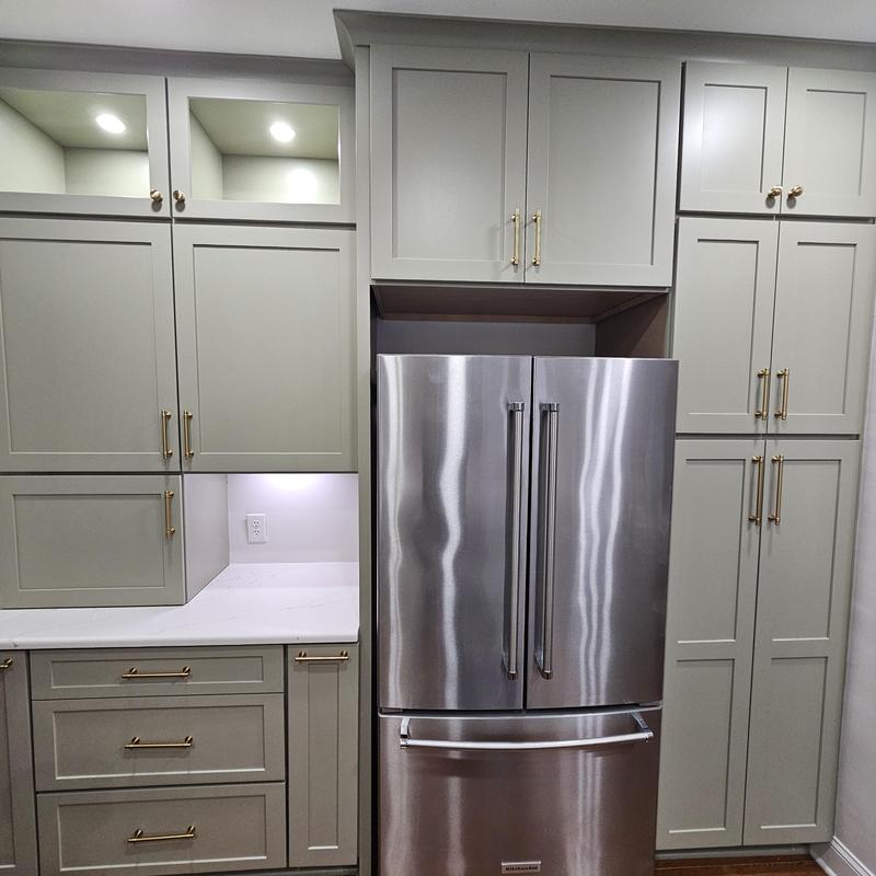 French door refrigerator with gray cabinetry and brass handles French door refrigerator with gray cabinetry and brass handles