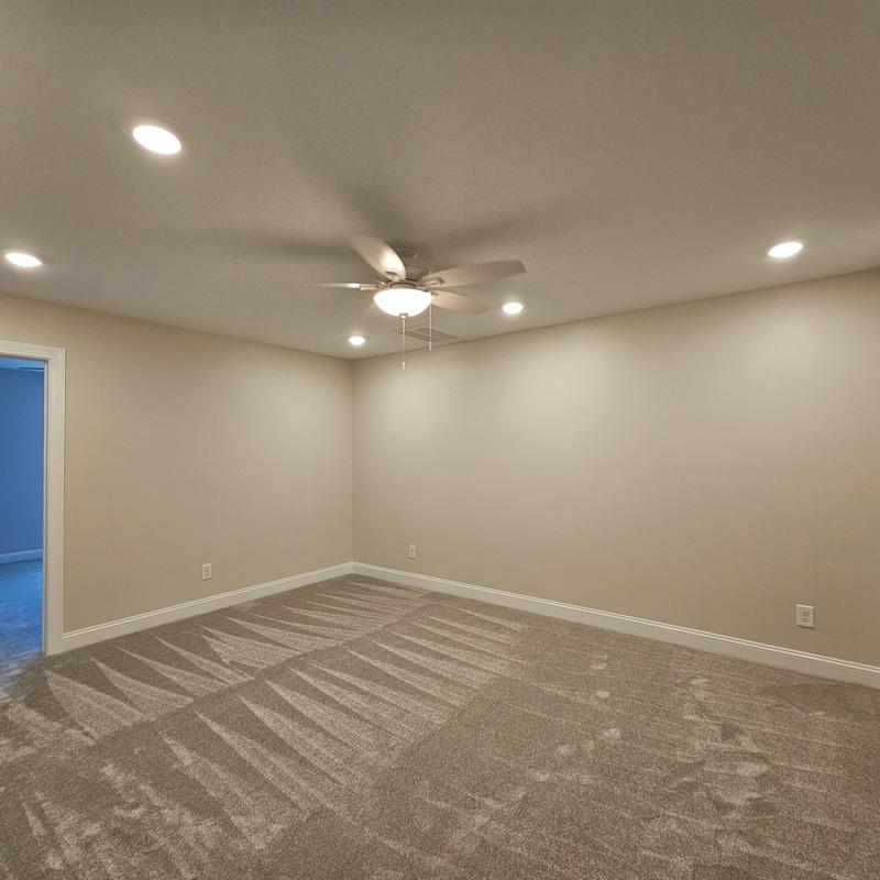 Ceiling fan and recessed lighting in empty room Ceiling fan and recessed lighting in empty room