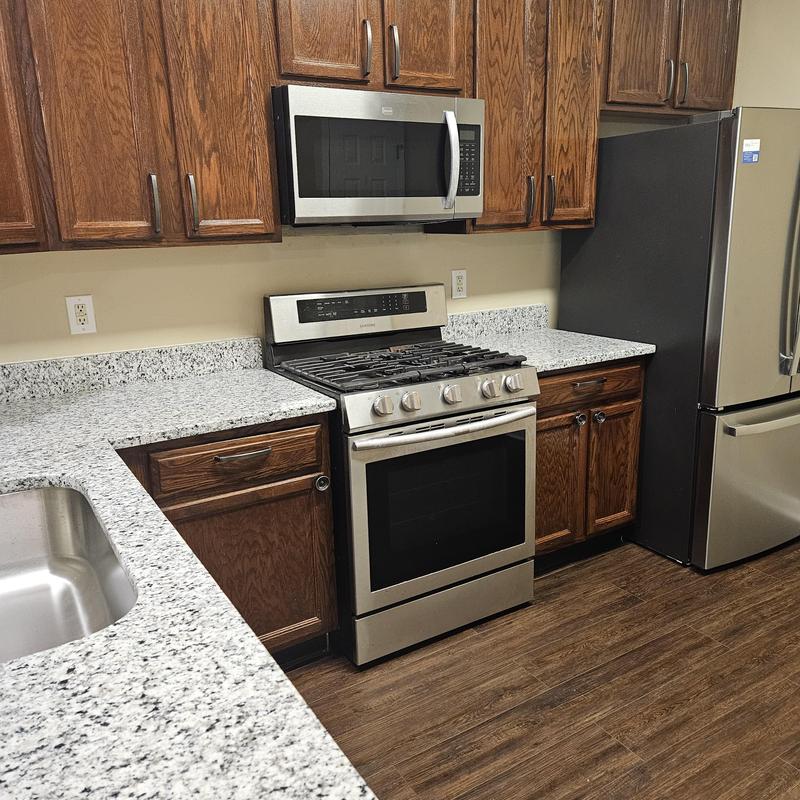 Granite countertops and stainless steel appliances in kitchen Granite countertops and stainless steel appliances in kitchen