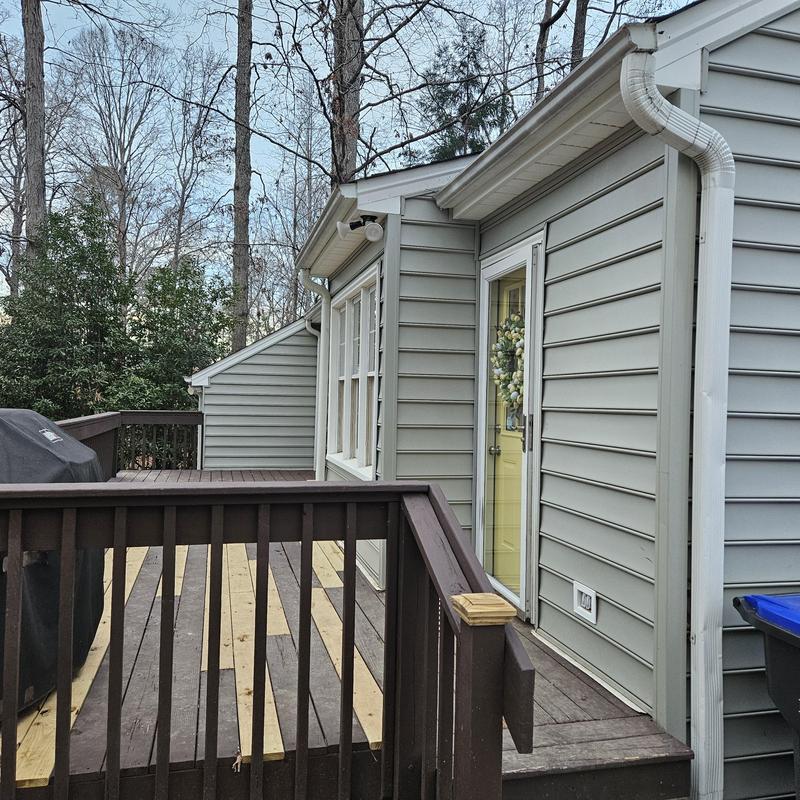 Vinyl siding and wooden deck remodeling in backyard Vinyl siding and wooden deck remodeling in backyard