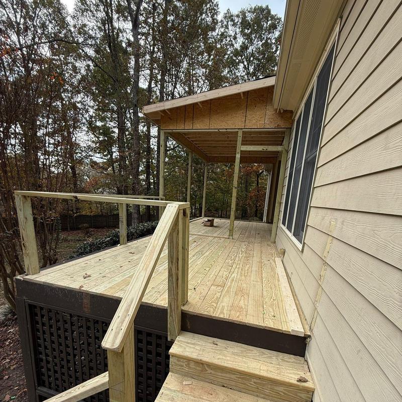 Wood deck and railing installation with covered porch Wood deck and railing installation with covered porch