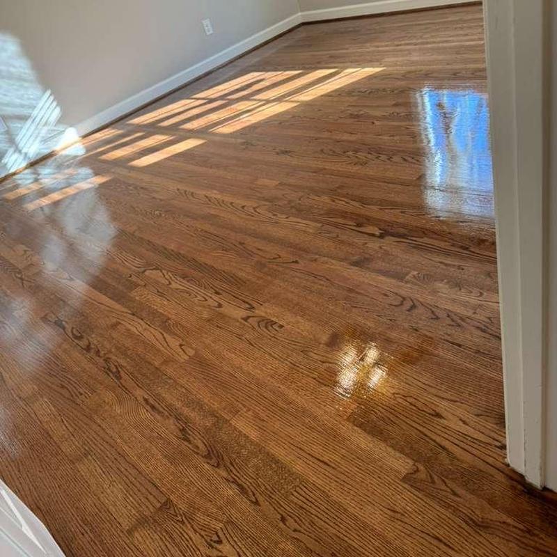 Hardwood floor polished with natural finish in empty room Hardwood floor polished with natural finish in empty room
