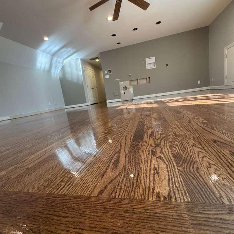 Hardwood floor with fresh polish in living room Hardwood floor with fresh polish in living room