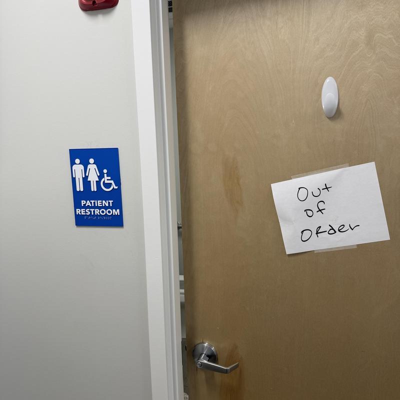 Patient restroom door with out of order sign Patient restroom door with out of order sign