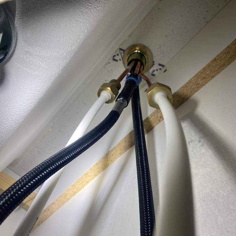 Faucet supply lines and connectors under kitchen sink Faucet supply lines and connectors under kitchen sink