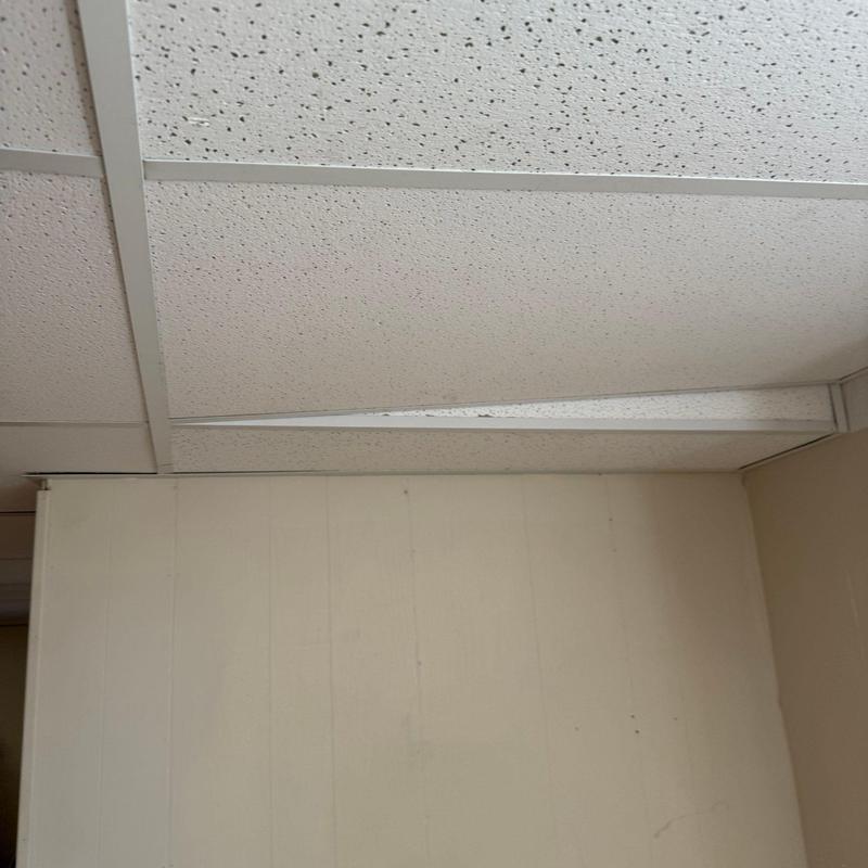 Suspended ceiling tile misalignment in indoor room