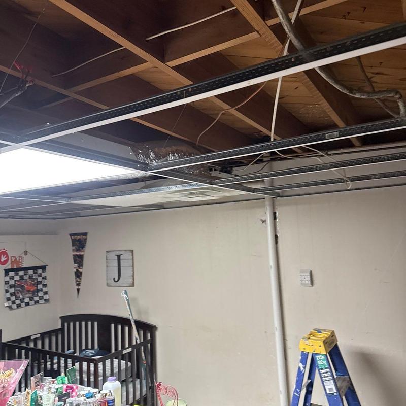 Ceiling grid system exposed with ductwork above
