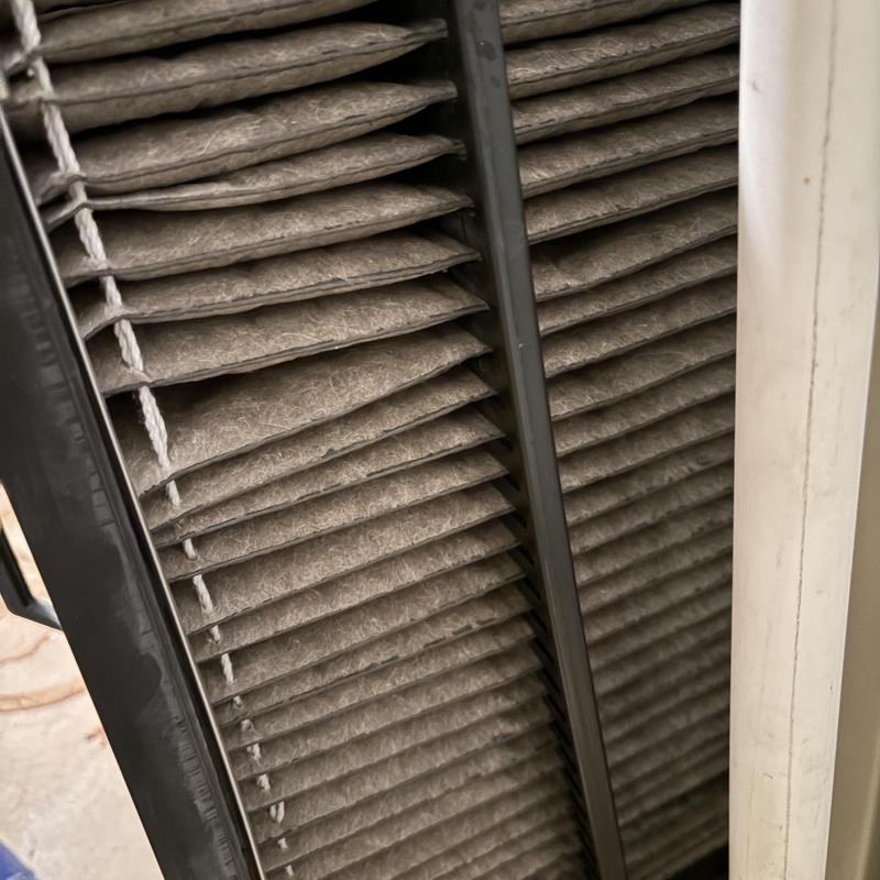 HVAC furnace air filter clogged with dust buildup