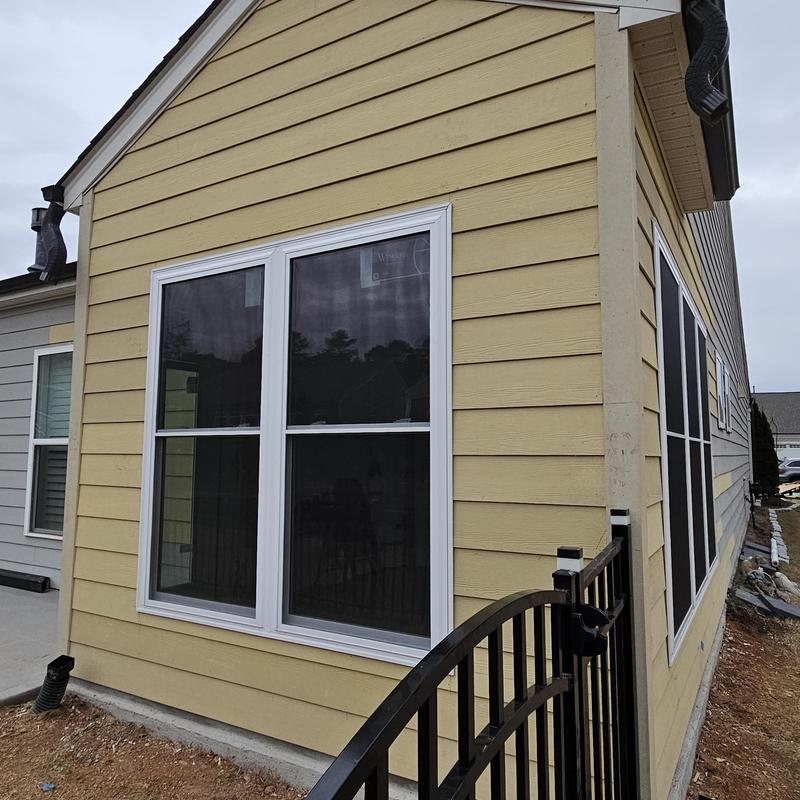 Vinyl windows and yellow siding on home addition exterior Vinyl windows and yellow siding on home addition exterior