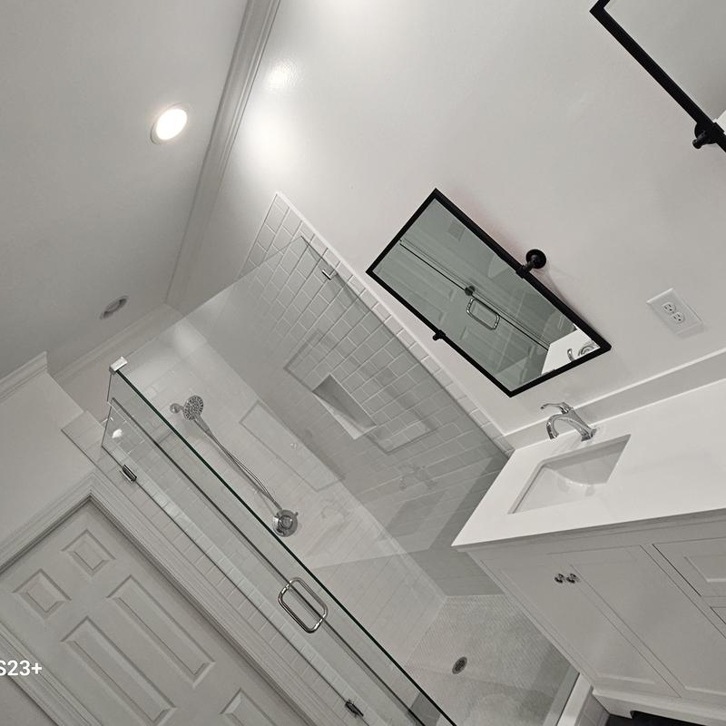 Glass shower enclosure and white tile bath remodeling Glass shower enclosure and white tile bath remodeling