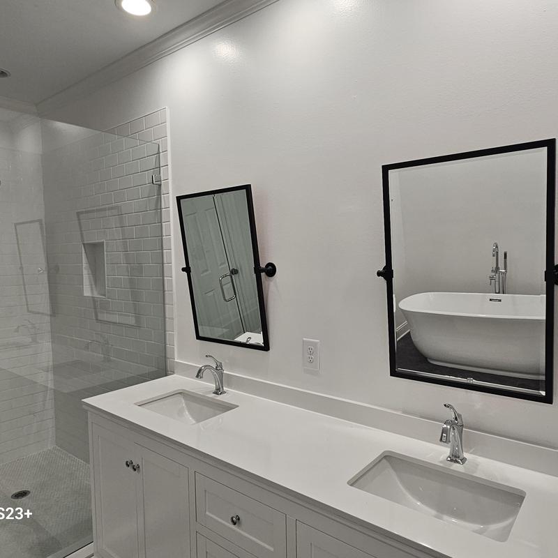 Double bathroom sinks with modern faucets and mirrors Double bathroom sinks with modern faucets and mirrors