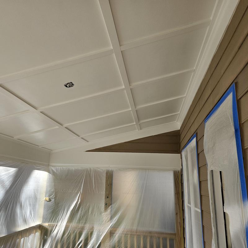 Porch ceiling panel installation with taped windows and siding Porch ceiling panel installation with taped windows and siding