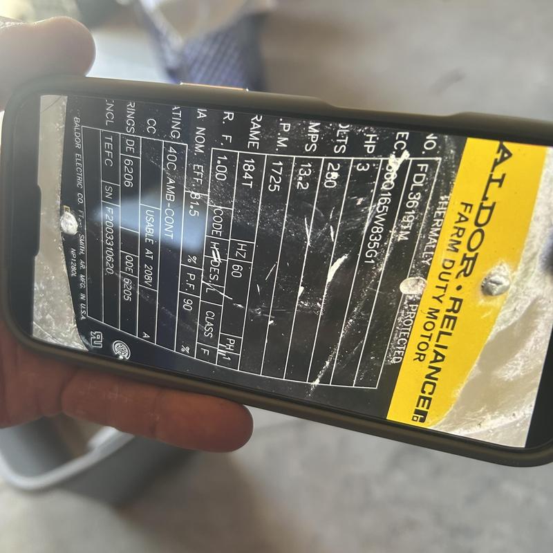 Farm duty motor nameplate data on smartphone screen Farm duty motor nameplate data on smartphone screen
