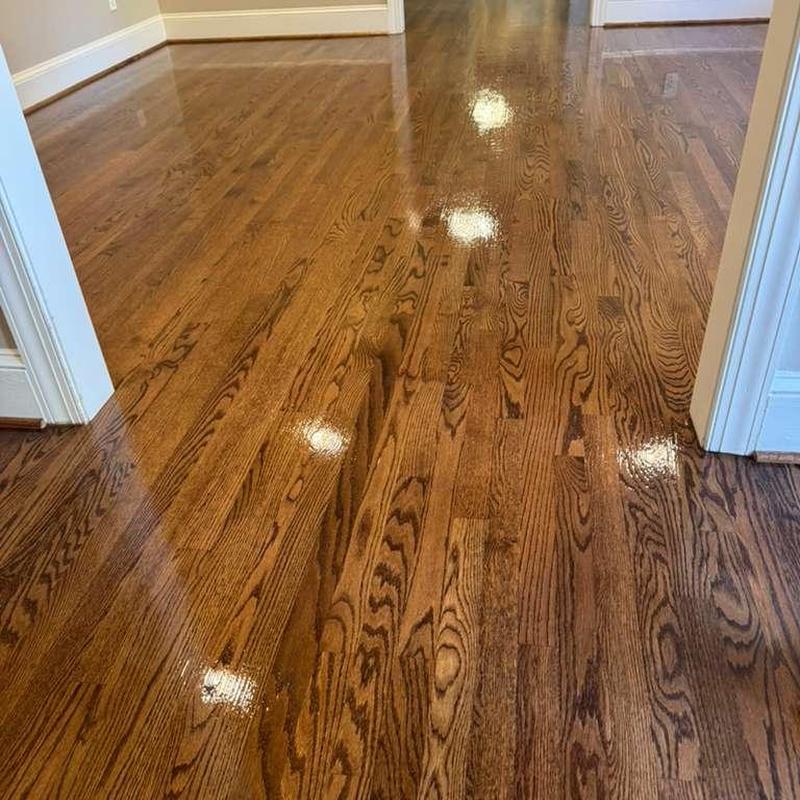 Hardwood flooring with glossy finish in residential room Hardwood flooring with glossy finish in residential room