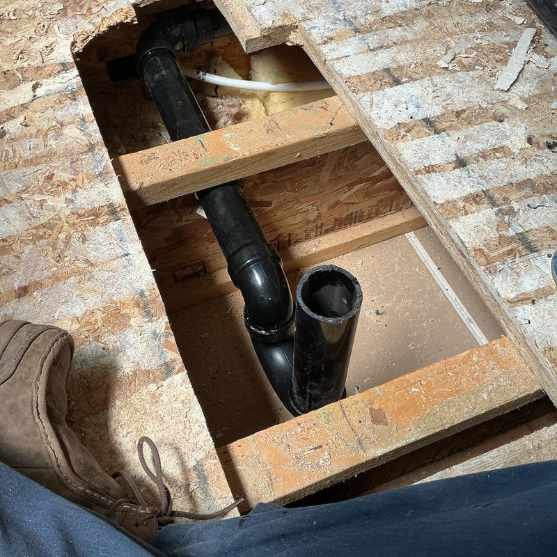 Shower drain pipe installation in subfloor opening