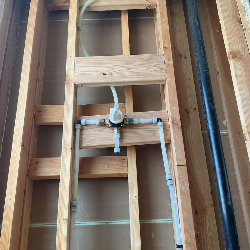 Shower valve installation with piping in wall framing
