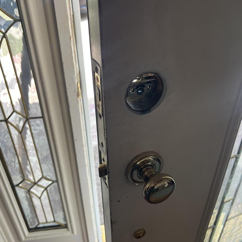 Front door lock housing removed for rekeying