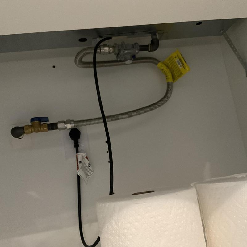 Stove top gas supply line with valve and fittings