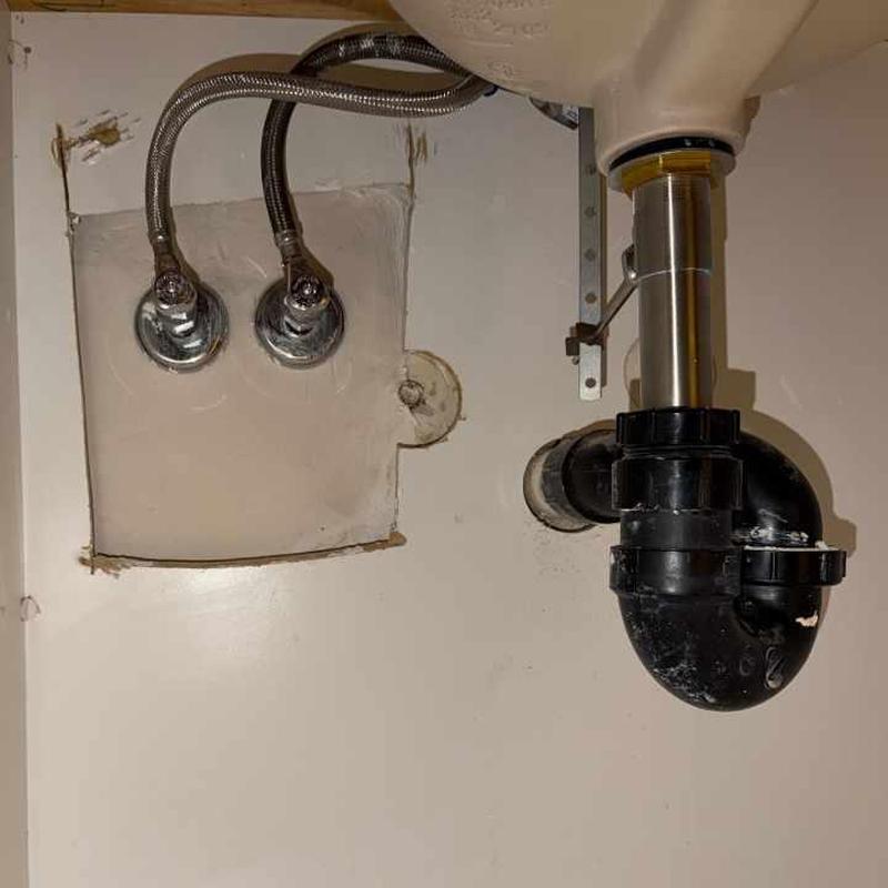 Kitchen sink drain and water supply lines installation