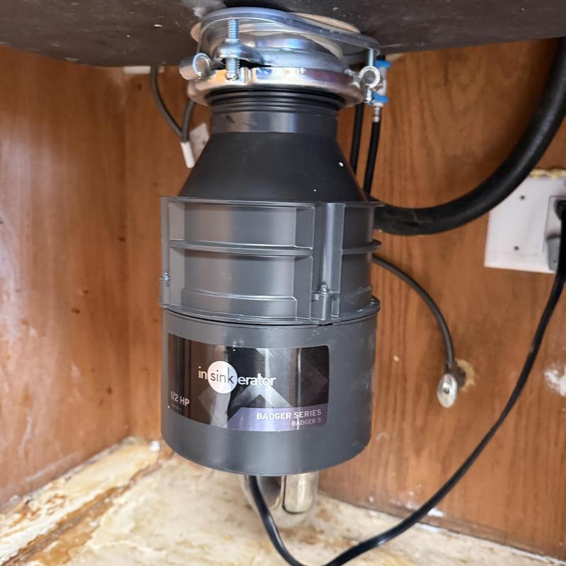 Garbage disposal installation under kitchen sink