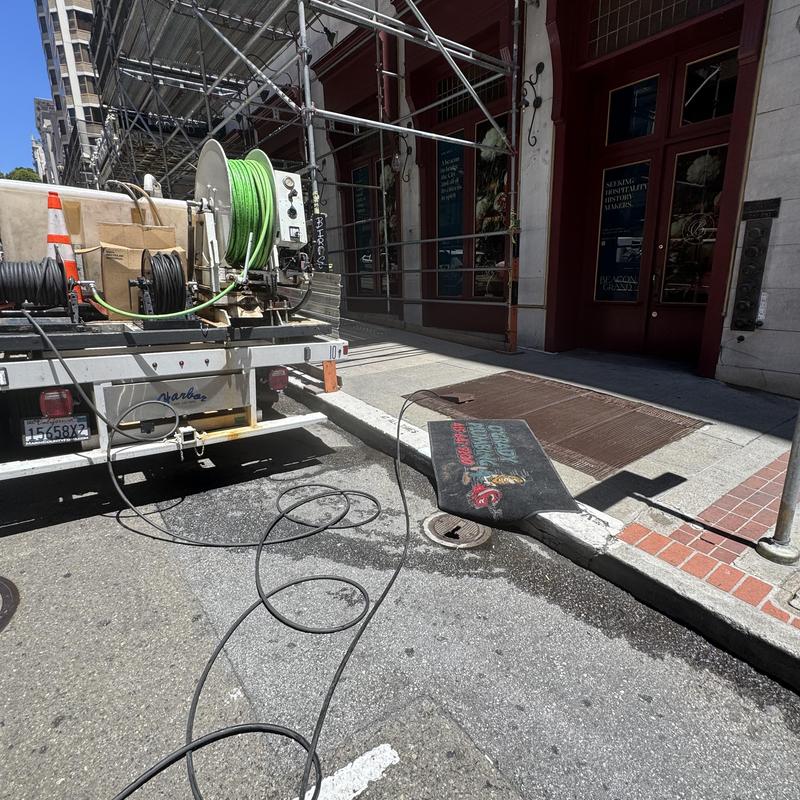 Drain line hydro jetting at commercial property cleanout
