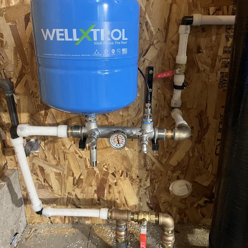 WellXtrol pressure tank with gauge and piping manifold
