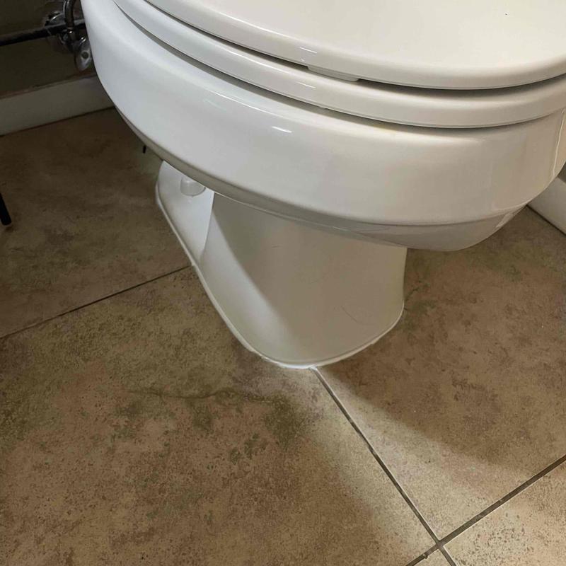Toilet base on tiled bathroom floor Toilet base on tiled bathroom floor