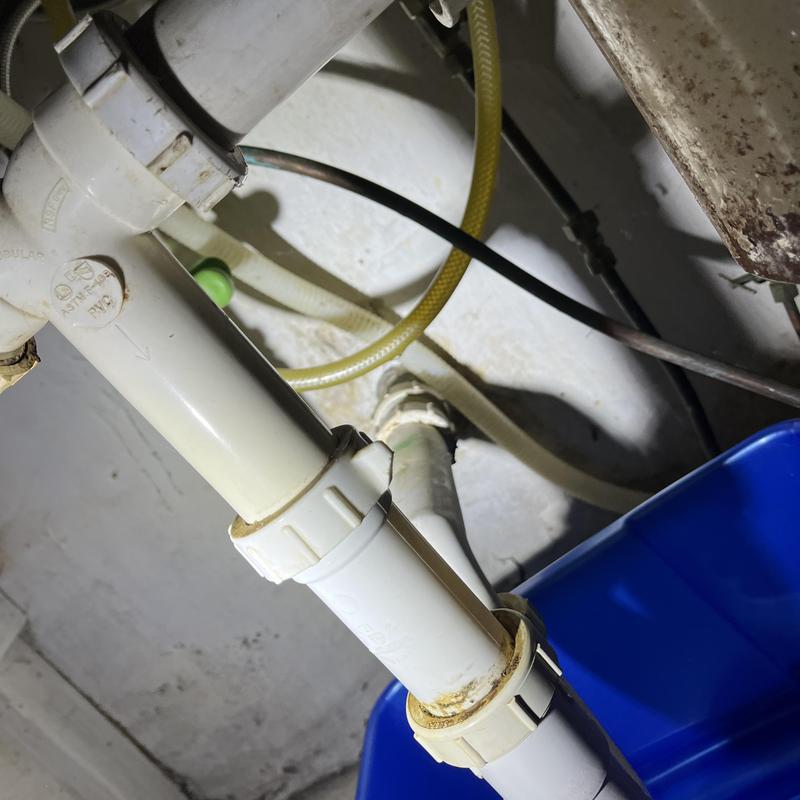 PVC tubular plumbing under kitchen sink with repairs PVC tubular plumbing under kitchen sink with repairs