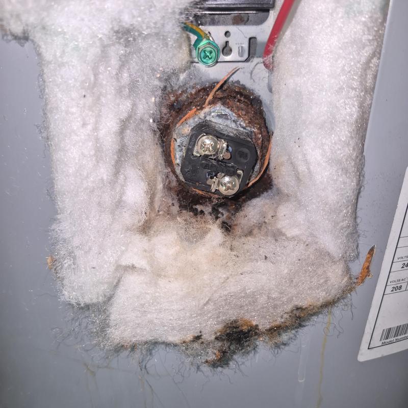 Water heater element terminal with rust and insulation damage