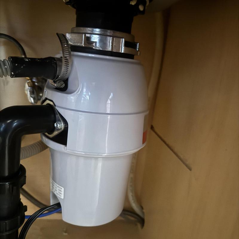 Garbage disposal installation under kitchen sink