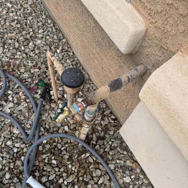 Hose bib with new shutoff valve and garden hose