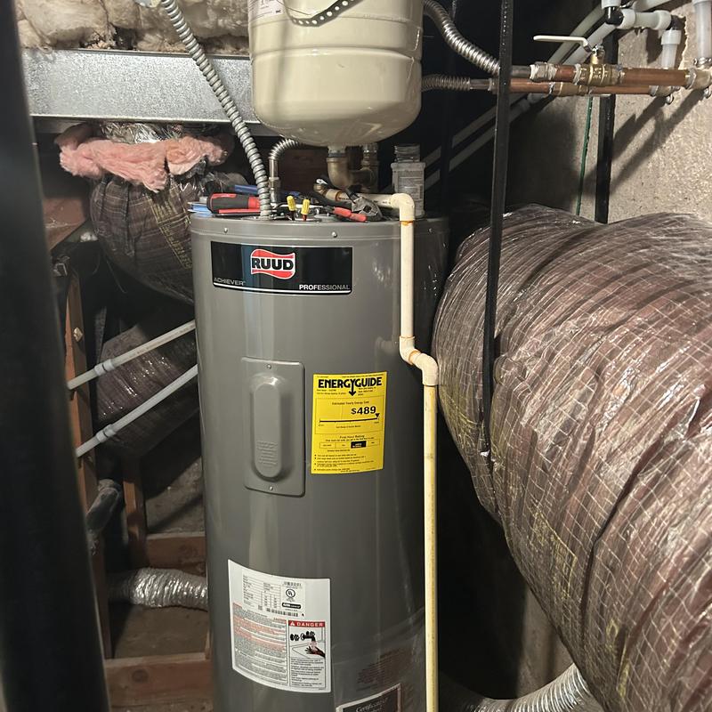 Water heater replacement with plumbing tools in basement Water heater replacement with plumbing tools in basement