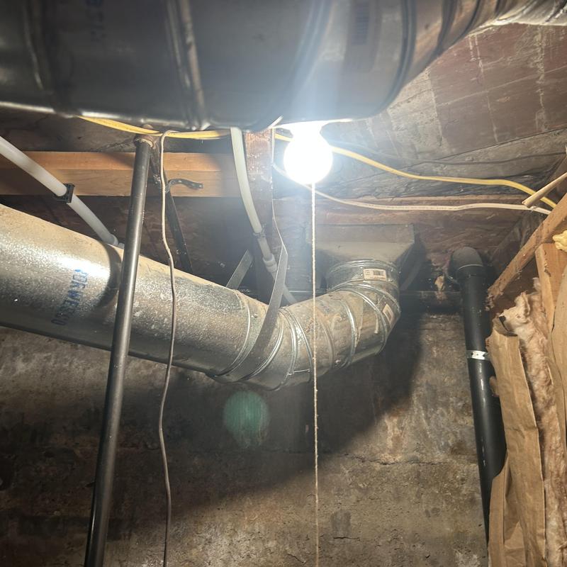 Basement ductwork and plumbing pipes with lighting Basement ductwork and plumbing pipes with lighting