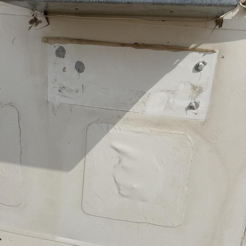Upper roof membrane patch with fasteners and sealant