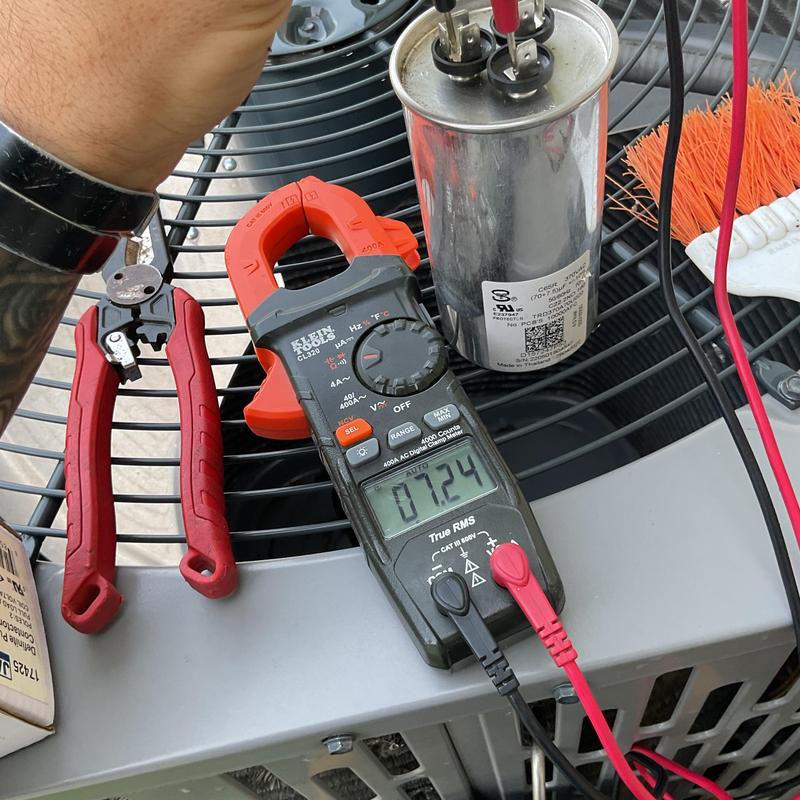 HVAC capacitor testing with clamp meter on AC unit HVAC capacitor testing with clamp meter on AC unit