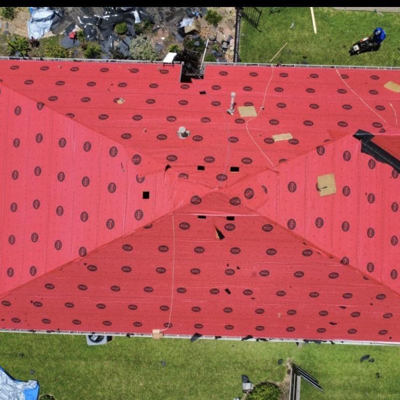Roof underlayment installation on residential home