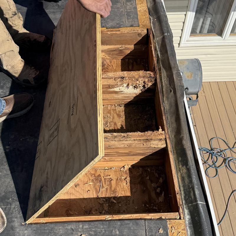 Roof decking removal exposing rotten wood at eave