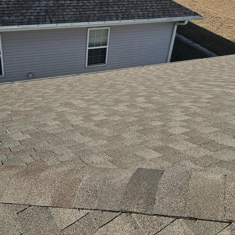Hip and ridge asphalt shingles on residential roof Hip and ridge asphalt shingles on residential roof